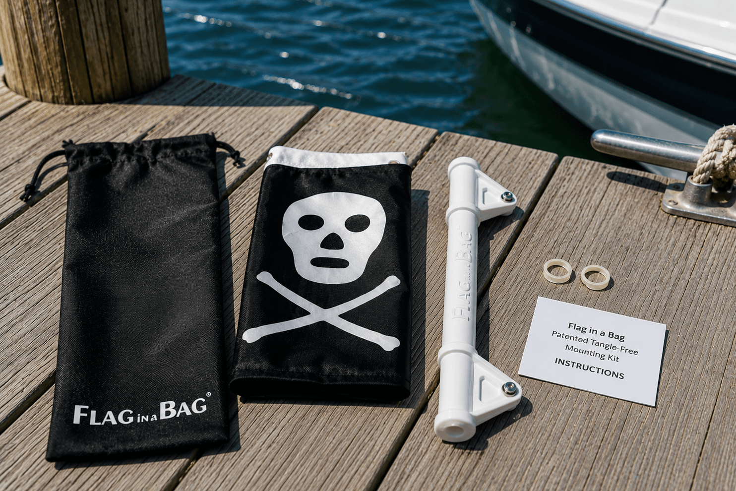 Flag in a Bag kit with skull and crossbones design on a dock by water